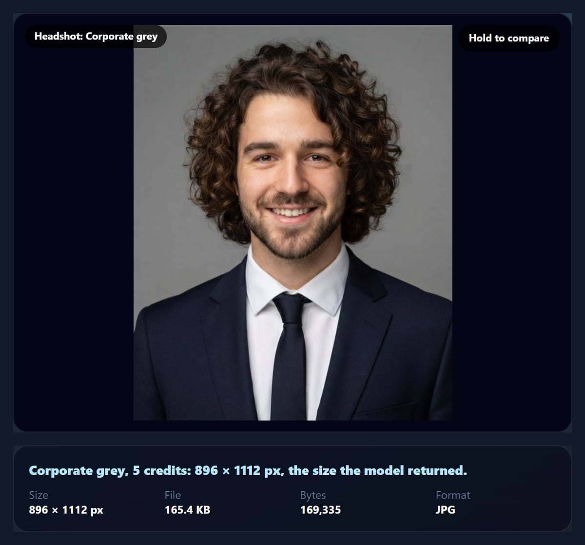 The AI headshot generator showing a corporate headshot in a navy suit on a grey backdrop