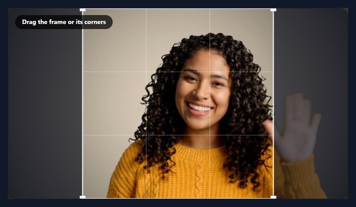 The crop videos tool with a square crop frame over the waving woman in the sample video