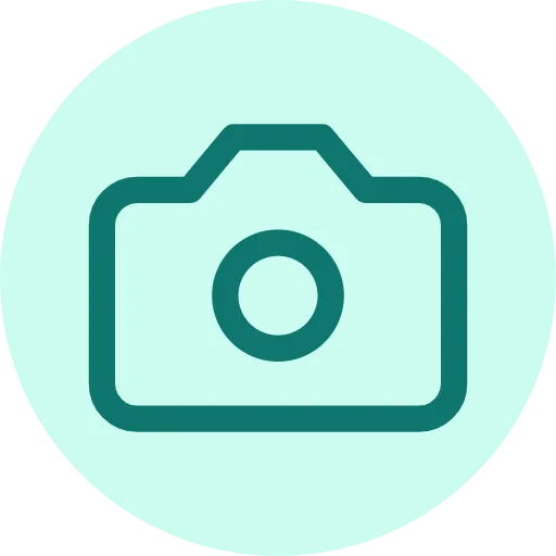 A teal camera icon on a mint circle