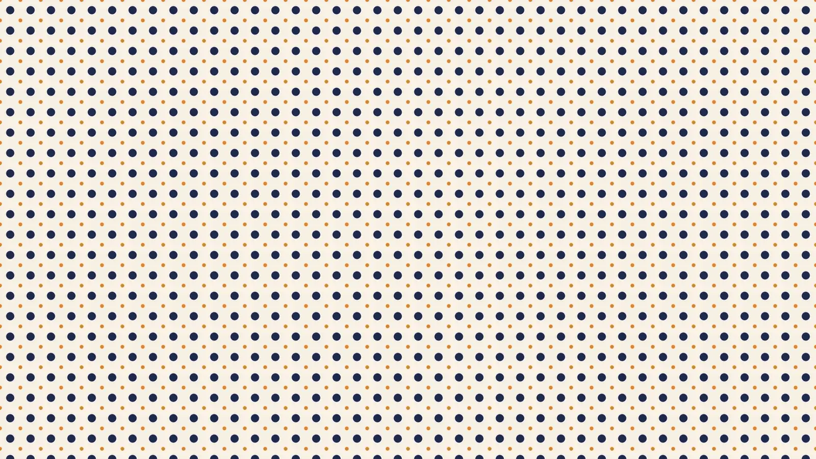 A navy polka-dot pattern with small orange accent dots on cream