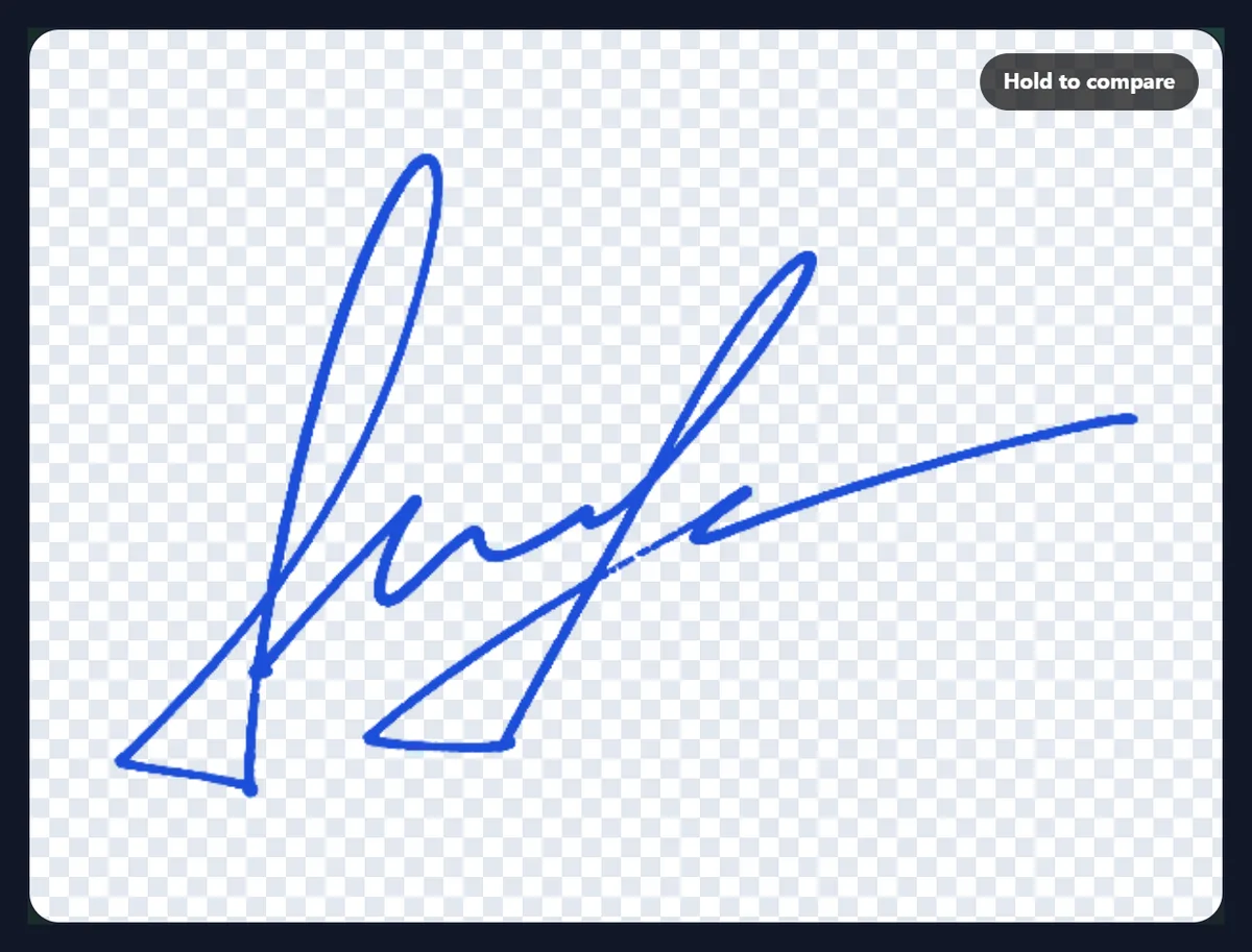 The sample signature in an even blue ink on a transparent checkerboard