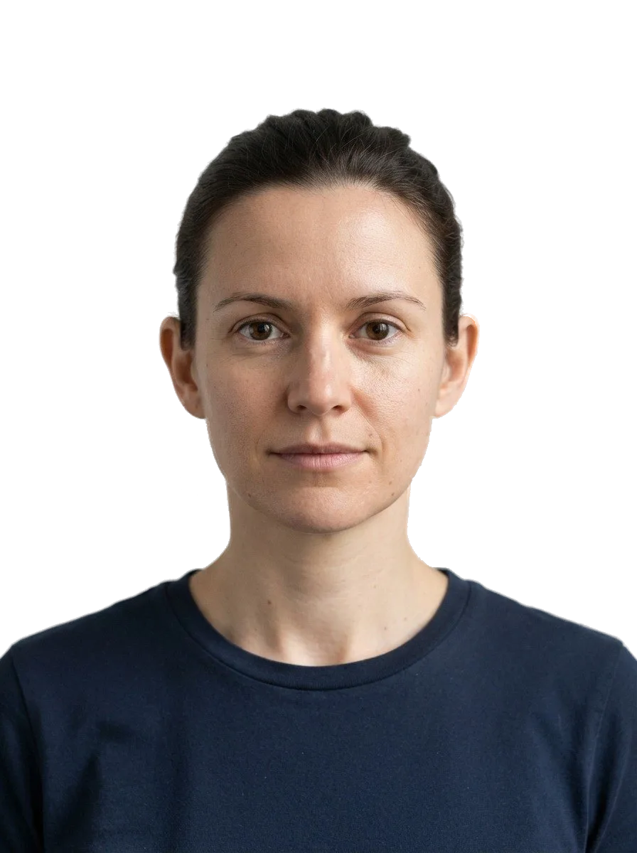 A studio portrait of a woman with the grey wall behind her made transparent