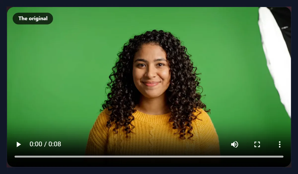 The video to MP4 converter with the sample WebM open, showing a woman in a yellow jumper waving against a green wall
